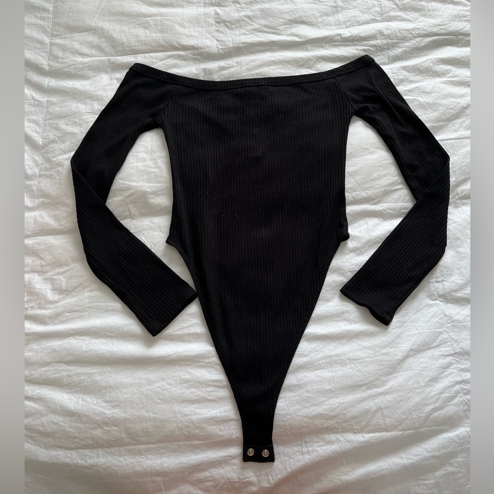 Off shoulder black body suit.